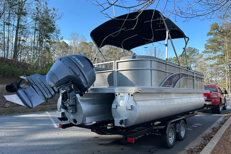 Slide: The Image of 2023 Bennington 22 SSRX pontoon boat on trailer with Yamaha outboard motor. - 5
