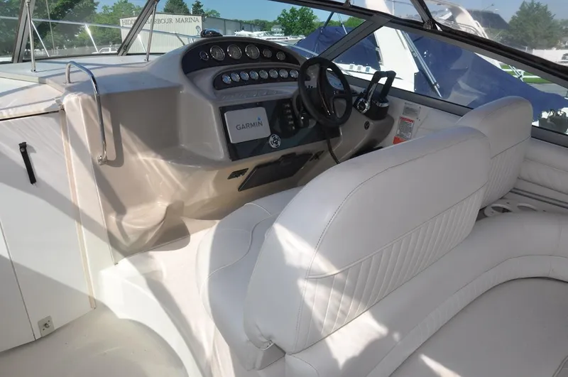 Slide: The Image of 2006 Monterey 322 Cruiser helm with Garmin navigation system and white leather seating. - 10