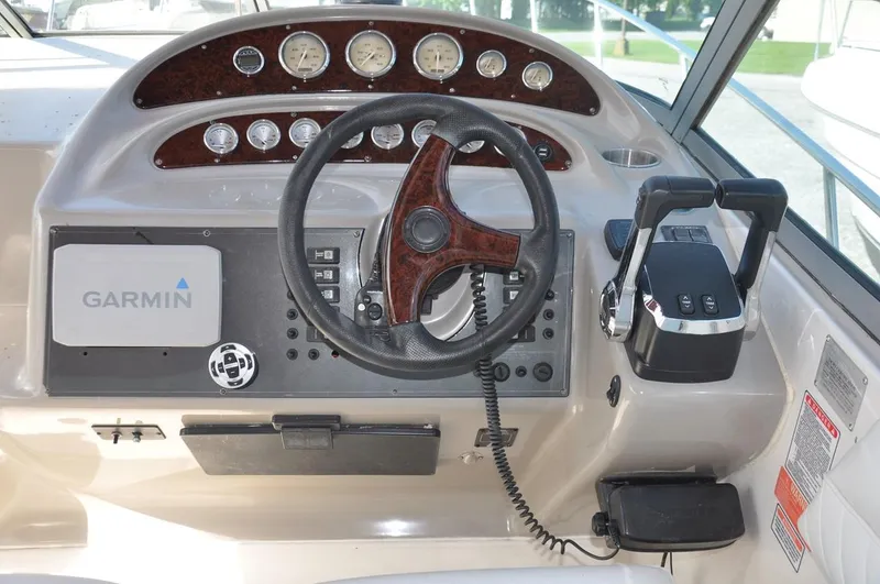 Slide: The Image of 2006 Monterey 322 Cruiser helm with Garmin navigation system and control panel. - 11