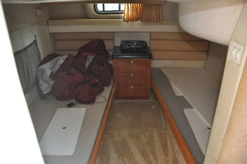 Slide: The Image of Interior cabin of a 2006 Monterey 322 Cruiser with twin beds and storage. - 18