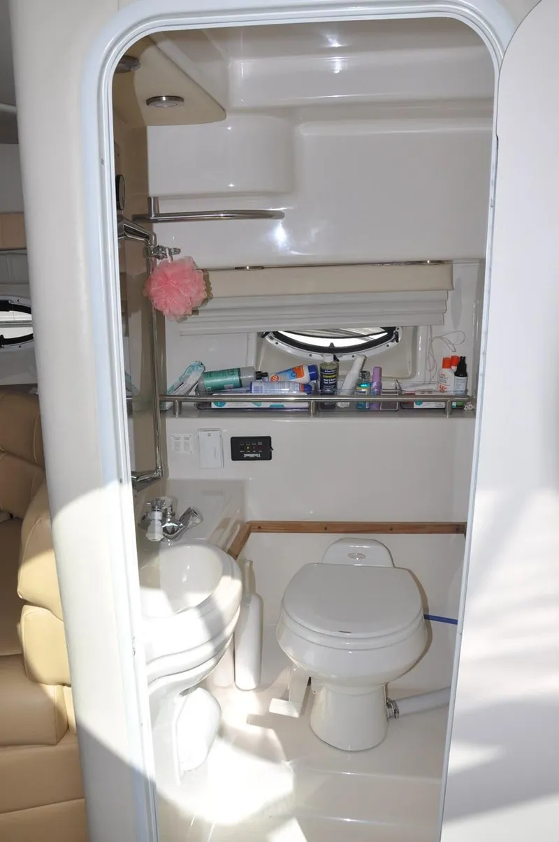 Slide: The Image of Bathroom interior of a 2006 Monterey 322 Cruiser boat. - 19