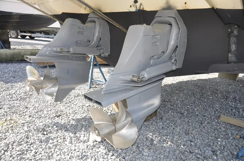 Slide: The Image of 2006 Monterey 322 Cruiser dual propellers on gravel surface. - 23