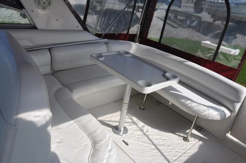 Slide: The Image of 2006 Monterey 322 Cruiser interior seating area with table. - 8