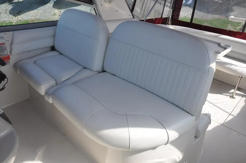 Slide: The Image of 2006 Monterey 322 Cruiser white leather seating area. - 9