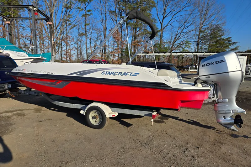 The Image of 2019 Starcraft MDX 211 O/B boat with Honda outboard motor on trailer. - 0