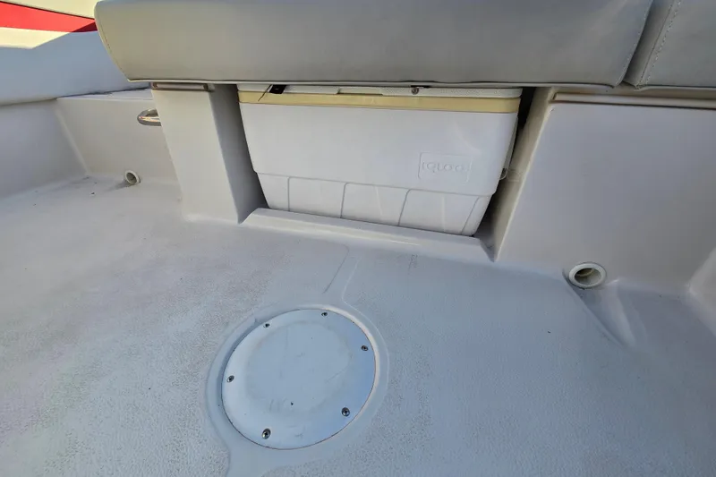 Slide: The Image of 2019 Starcraft MDX 211 O/B boat interior with built-in cooler and seating. - 27