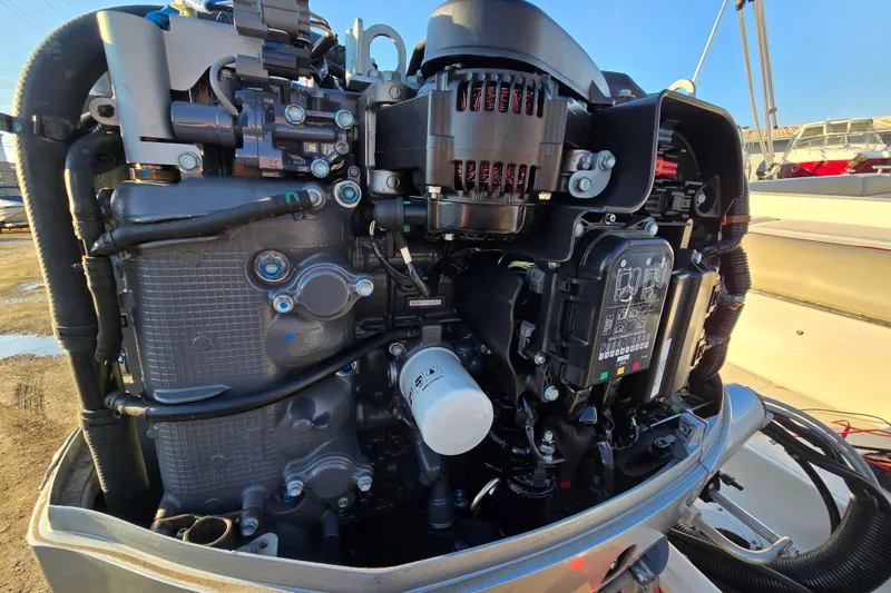 Slide: The Image of 2019 Starcraft MDX 211 O/B boat engine close-up, showcasing intricate mechanical components. - 38