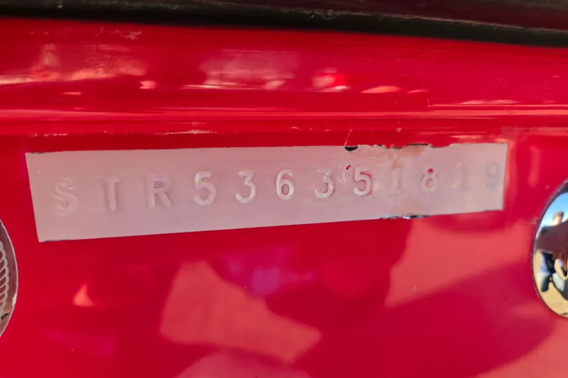 Slide: The Image of Red Starcraft MDX 211 O/B 2019 boat with visible serial number plate. - 41