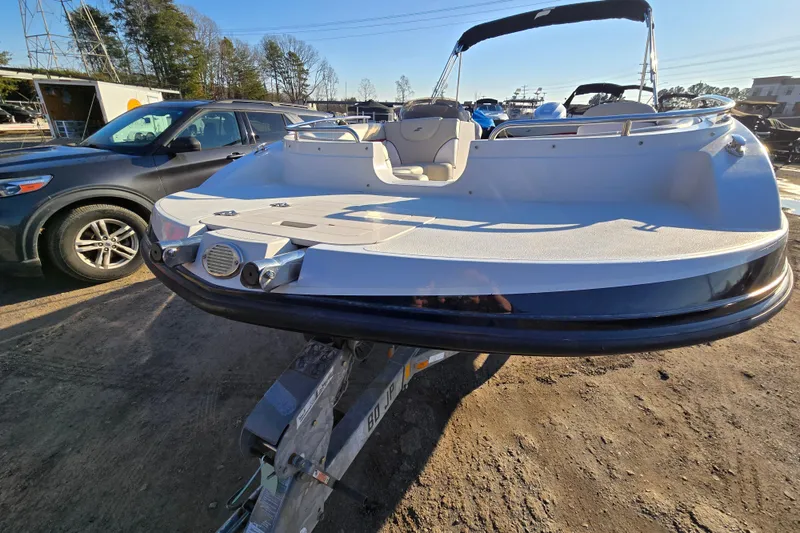 Slide: The Image of 2019 Starcraft MDX 211 O/B boat on trailer, parked outdoors in a lot. - 9