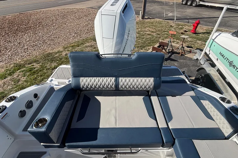 Slide: The Image of 2026 Monterey Elite 27 OB boat with luxurious seating and modern design. - 10