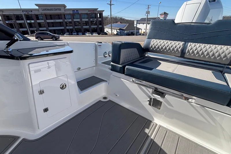 Slide: The Image of 2026 Monterey Elite 27 OB boat interior with sleek seating and modern design. - 11