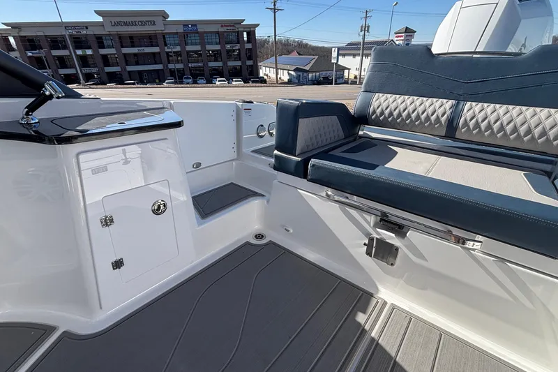 Slide: The Image of 2026 Monterey Elite 27 OB boat interior with sleek seating and modern design. - 12