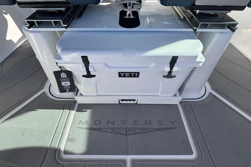 Slide: The Image of 2026 Monterey Elite 27 OB boat deck with Yeti cooler and seating. - 22