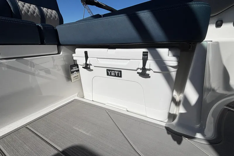 Slide: The Image of YETI cooler on 2026 Monterey Elite 27 OB boat, under seat storage. - 23