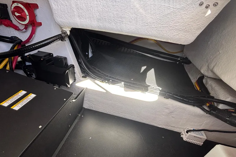 Slide: The Image of Interior view of 2026 Monterey Elite 27 OB boat wiring and components. - 27