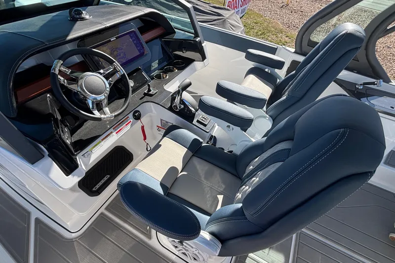 Slide: The Image of 2026 Monterey Elite 27 OB boat interior with modern dashboard and comfortable seating. - 29