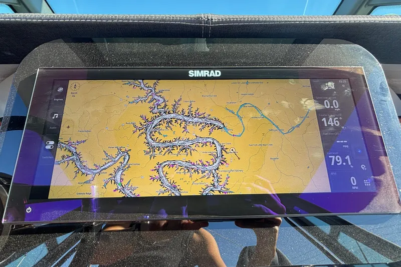 Slide: The Image of Simrad navigation display on 2026 Monterey Elite 27 OB boat dashboard. - 35