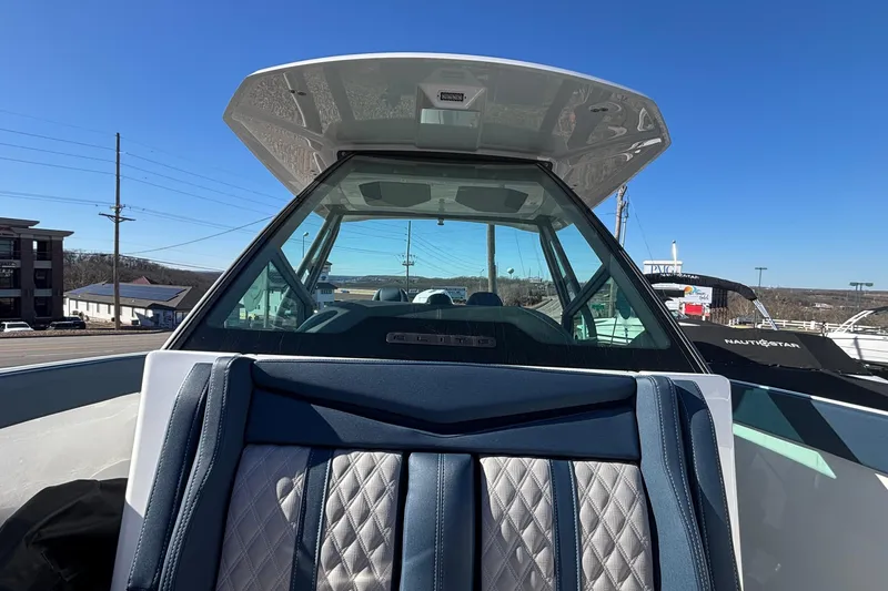 Slide: The Image of 2026 Monterey Elite 27 OB boat with sleek design and luxurious seating. - 36