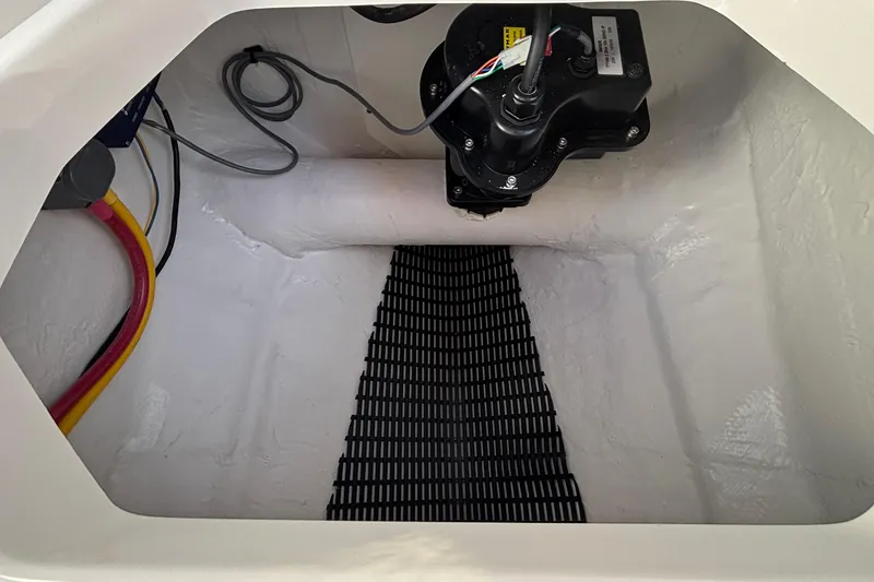 Slide: The Image of Interior view of 2026 Monterey Elite 27 OB boat compartment with wiring and equipment. - 38