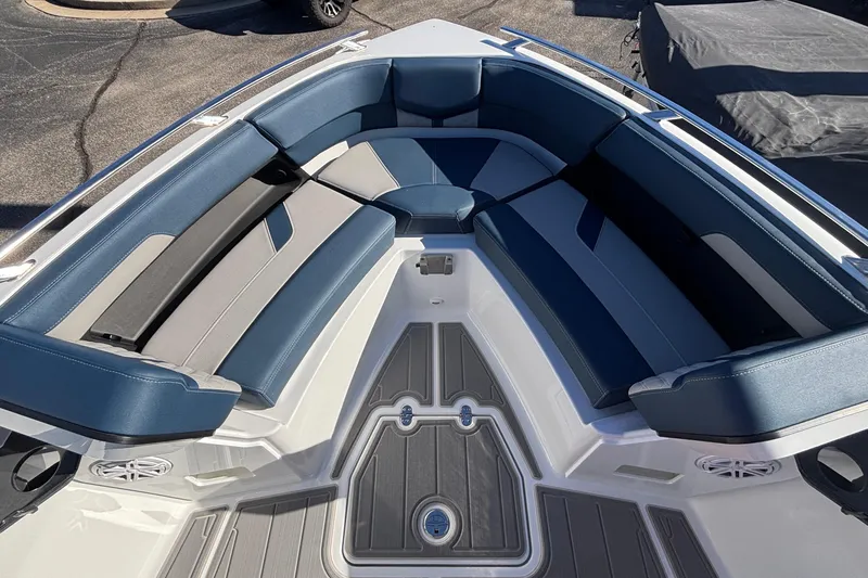 Slide: The Image of 2026 Monterey Elite 27 OB boat interior with blue and gray seating, modern design. - 40