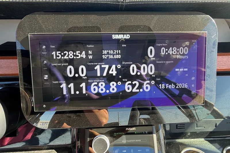 Slide: The Image of Simrad display on 2026 Monterey Elite 27 OB showing navigation and engine data. - 42