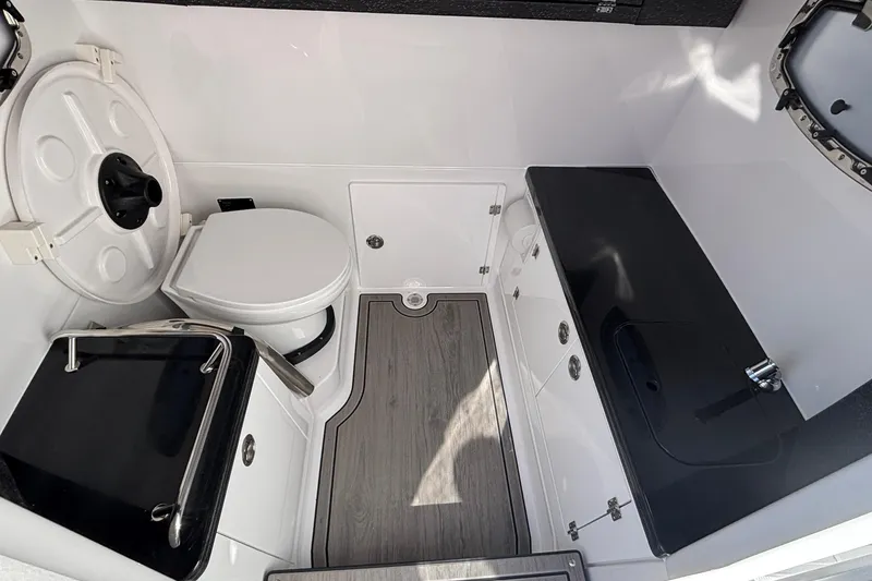 Slide: The Image of 2026 Monterey Elite 27 OB boat interior with modern bathroom amenities. - 46