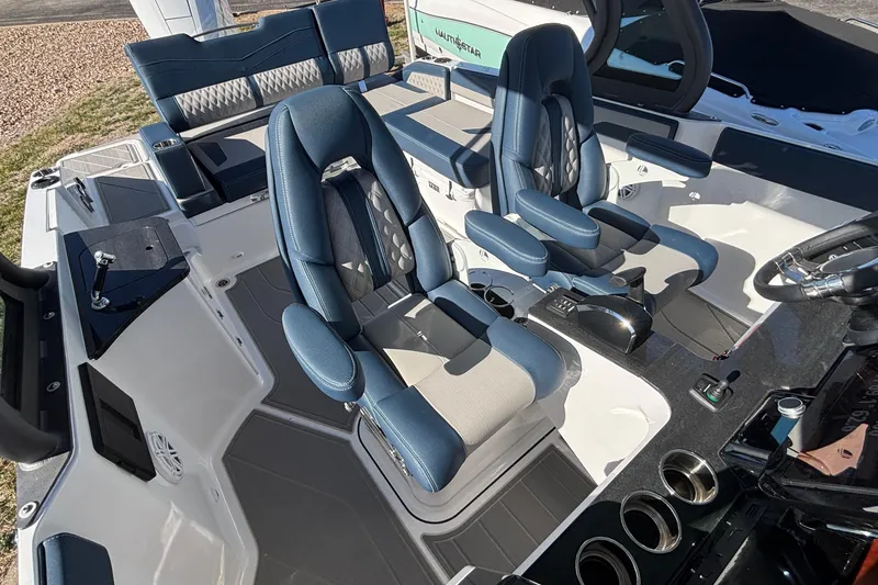 Slide: The Image of Luxury interior of 2026 Monterey Elite 27 OB boat with blue and gray seating. - 62