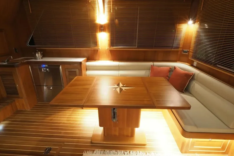 Slide: The Image of Luxurious interior of 2025 Helmsman Trawlers 46 Pilothouse with elegant wood finishes. - 16