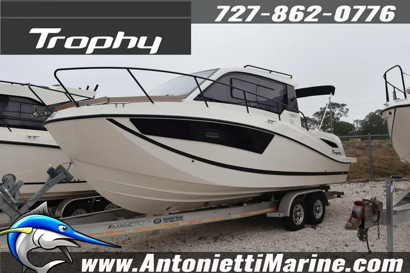 The Image of 2026 Bayliner Trophy T25 Explorer boat on trailer at Antonietti Marine dealership. - 0