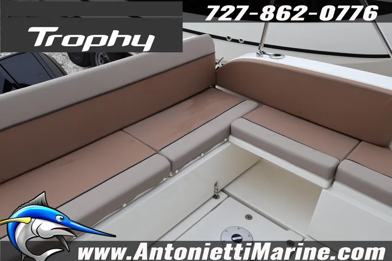 Slide: The Image of 2026 Bayliner Trophy T25 Explorer boat seating area with contact details and logo. - 10