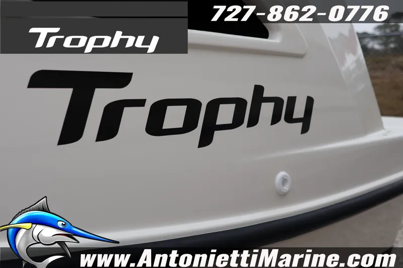 Slide: The Image of 2026 Bayliner Trophy T25 Explorer boat with logo and contact details. - 2