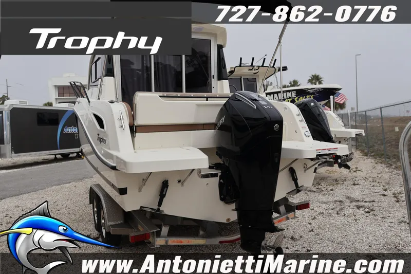 Slide: The Image of 2026 Bayliner Trophy T25 Explorer boat on trailer, featuring dual outboard motors. - 3