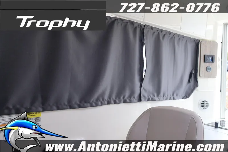Slide: The Image of 2026 Bayliner Trophy T25 Explorer interior with curtains, featuring Antonietti Marine branding. - 31