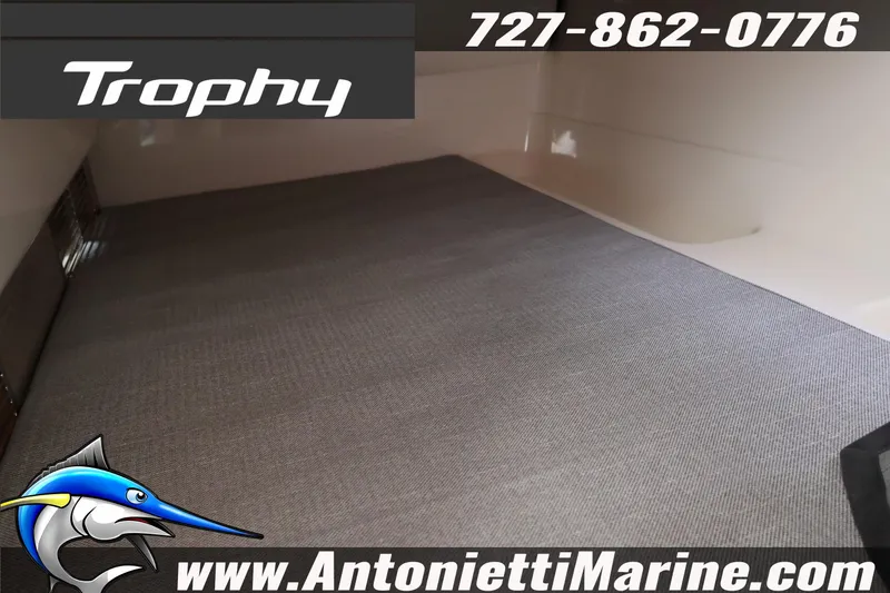 Slide: The Image of 2026 Bayliner Trophy T25 Explorer interior, featuring spacious cabin flooring. - 32