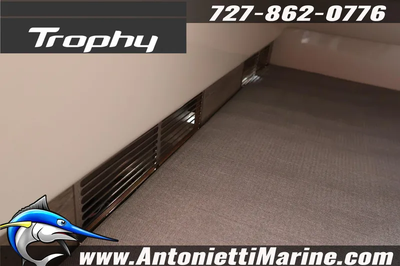 Slide: The Image of 2026 Bayliner Trophy T25 Explorer interior detail with contact information and logo. - 33
