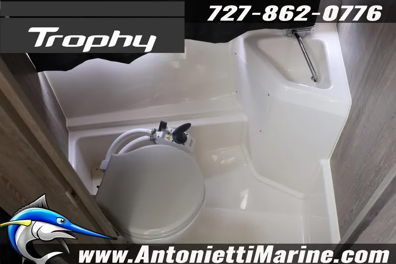 Slide: The Image of 2026 Bayliner Trophy T25 Explorer boat bathroom interior with toilet and sink. - 34
