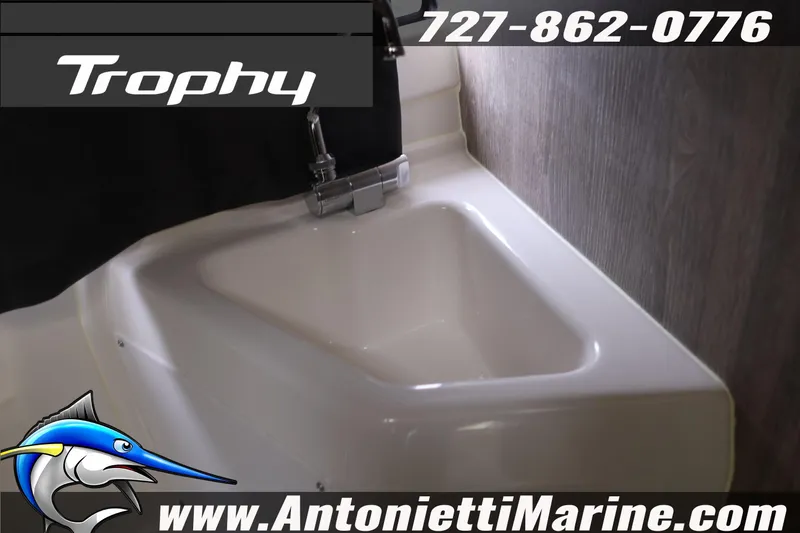 Slide: The Image of 2026 Bayliner Trophy T25 Explorer sink detail with contact information and logo. - 35