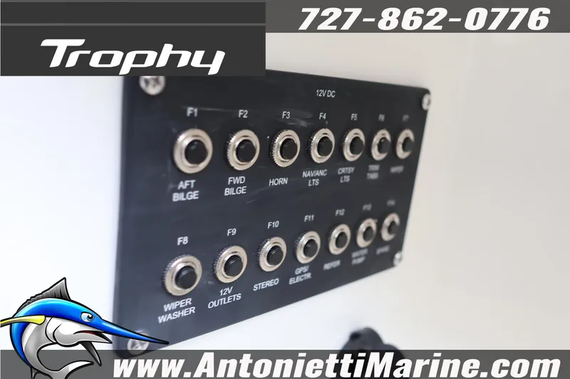 Slide: The Image of Control panel of 2026 Bayliner Trophy T25 Explorer boat with various switches and outlets. - 36