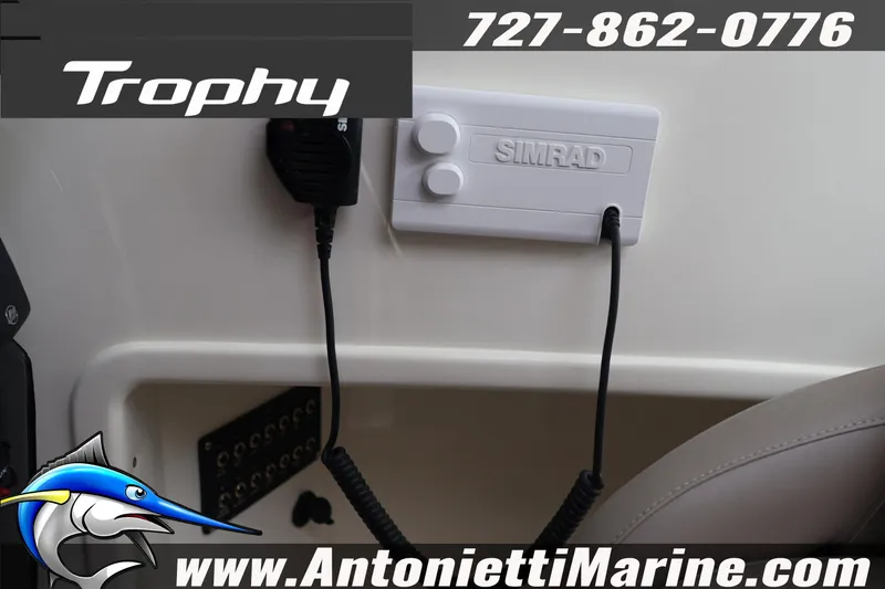 Slide: The Image of Bayliner Trophy T25 Explorer 2026 dashboard with Simrad equipment and contact details. - 38