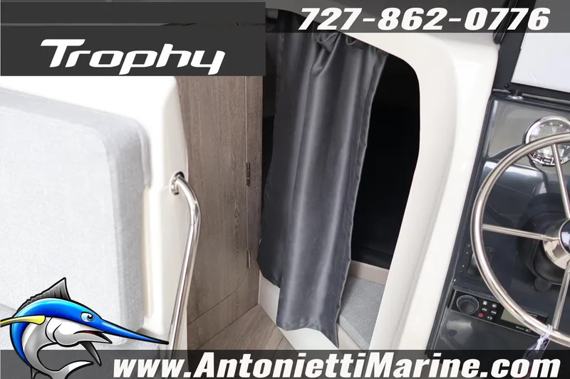 Slide: The Image of 2026 Bayliner Trophy T25 Explorer interior with steering wheel and cabin entrance. - 43