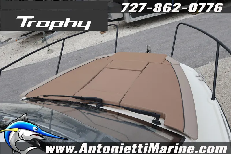 Slide: The Image of 2026 Bayliner Trophy T25 Explorer boat deck with brown cushions, Antonietti Marine branding. - 45