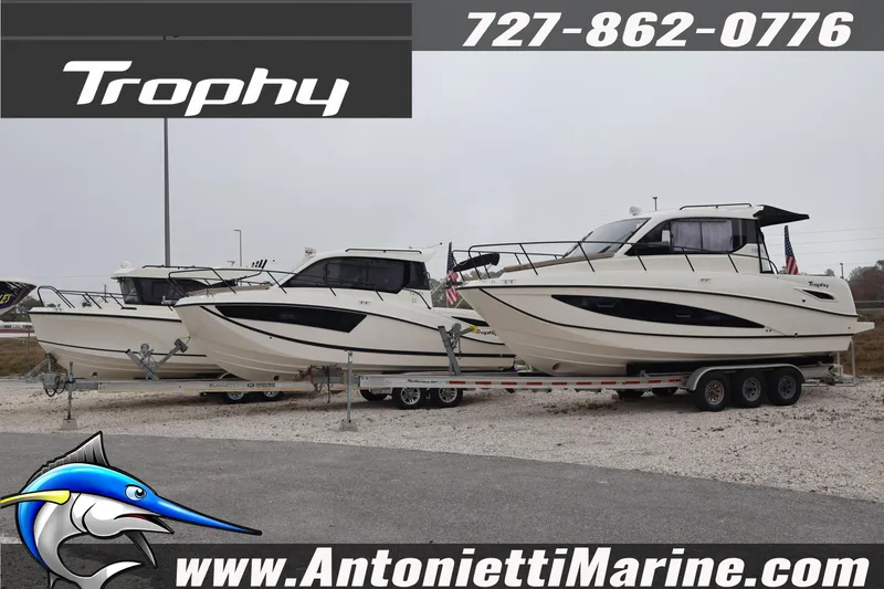 Slide: The Image of 2026 Bayliner Trophy T25 Explorer boats on trailers at Antonietti Marine dealership. - 5
