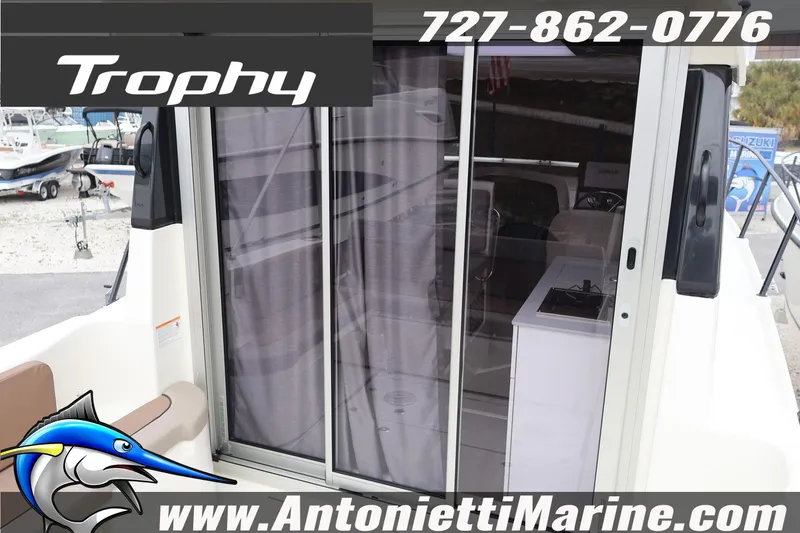Slide: The Image of 2026 Bayliner Trophy T25 Explorer boat with sliding glass door, showcased by Antonietti Marine. - 9