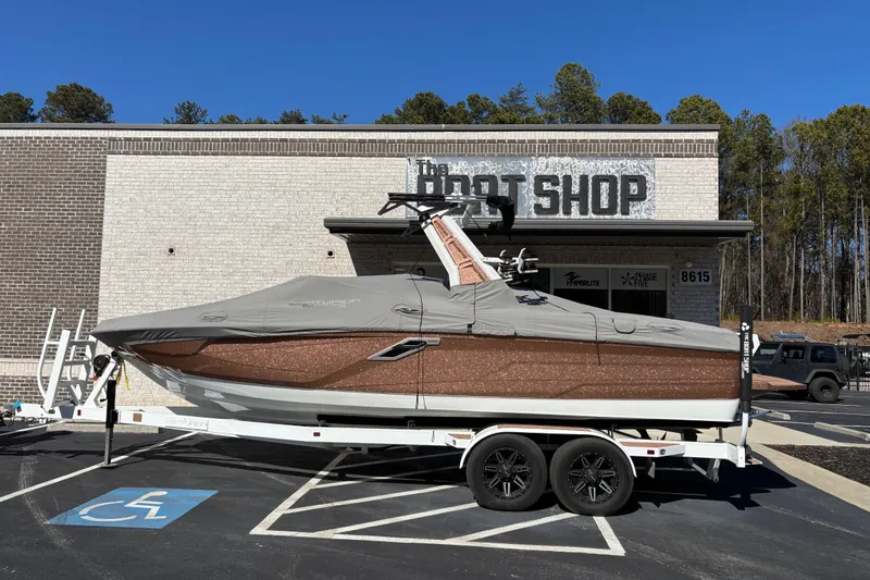 Slide: The Image of 2022 Centurion Ri245 boat on trailer outside The Boat Shop. - 5