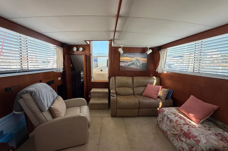 Slide: The Image of Interior of 1987 Viking 44 Motor Yacht with cozy seating and nautical decor. - 37