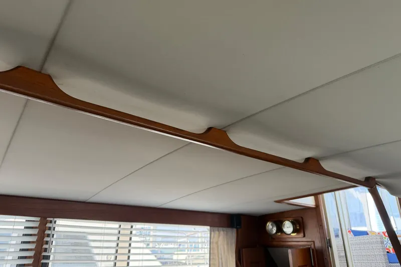 Slide: The Image of Interior ceiling of 1987 Viking 44 Motor Yacht with wooden accents and blinds. - 47