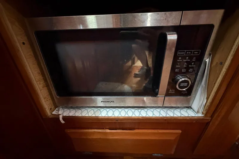 Slide: The Image of Microwave oven in 1987 Viking 44 Motor Yacht kitchen area. - 50