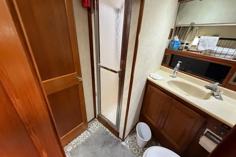 Slide: The Image of Bathroom interior of 1987 Viking 44 Motor Yacht with shower and sink. - 65