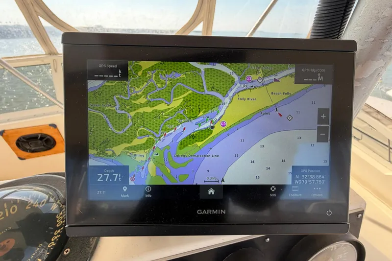 Slide: The Image of Garmin GPS display on 1987 Viking 44 Motor Yacht showing nautical map and coordinates. - 66