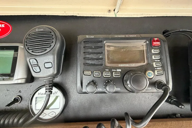 Slide: The Image of VHF marine radio equipment on 1987 Viking 44 Motor Yacht dashboard. - 68